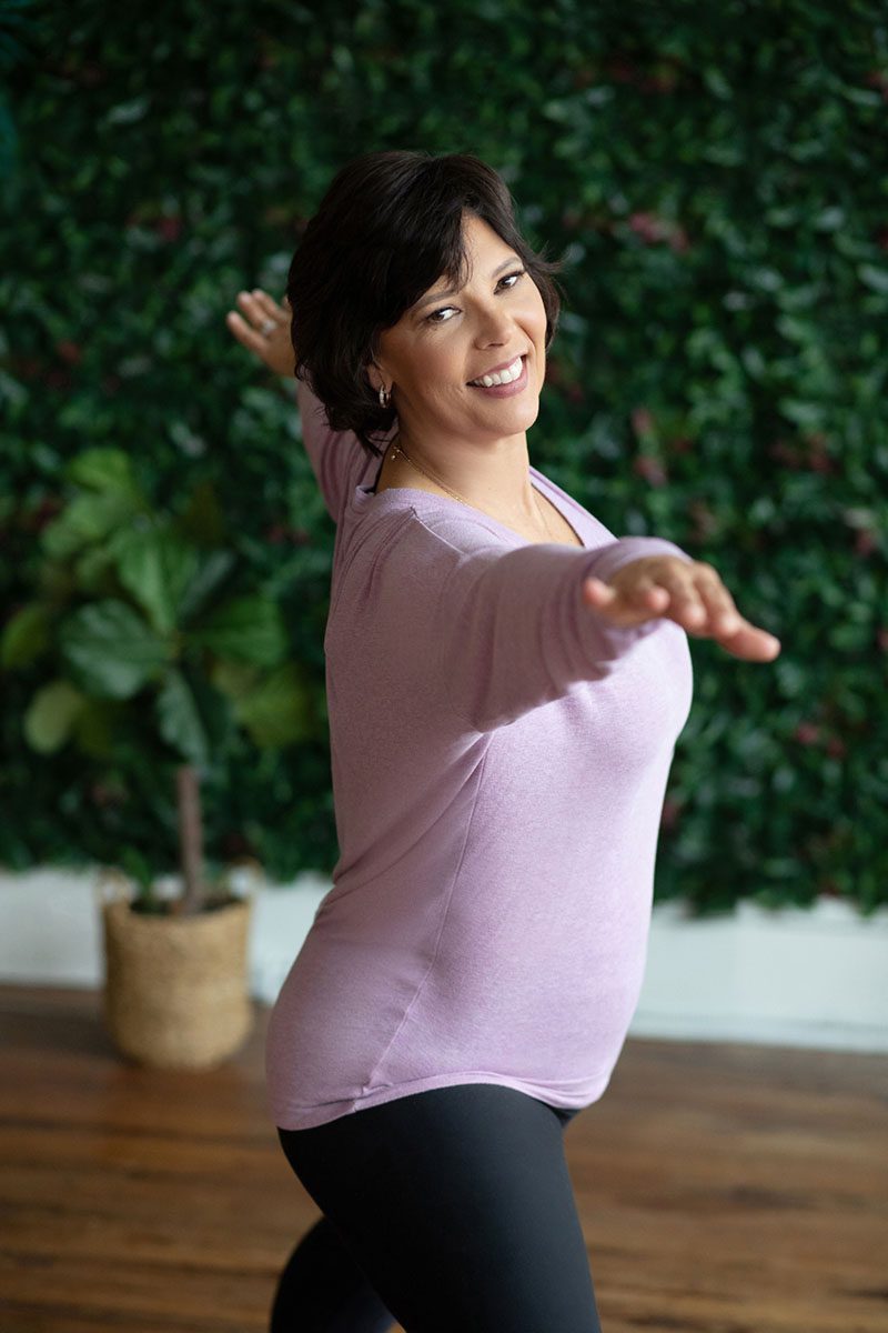 Yoga teacher posing in lifestyle branding photography portrait