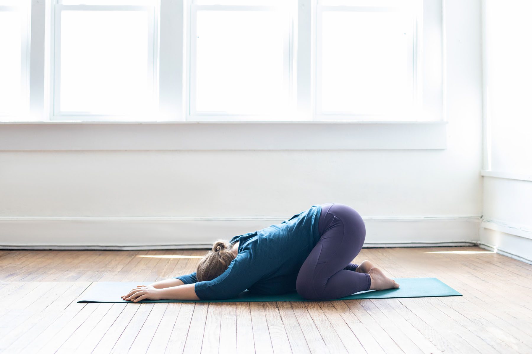 Fitness branding portrait of yoga teacher stretching
